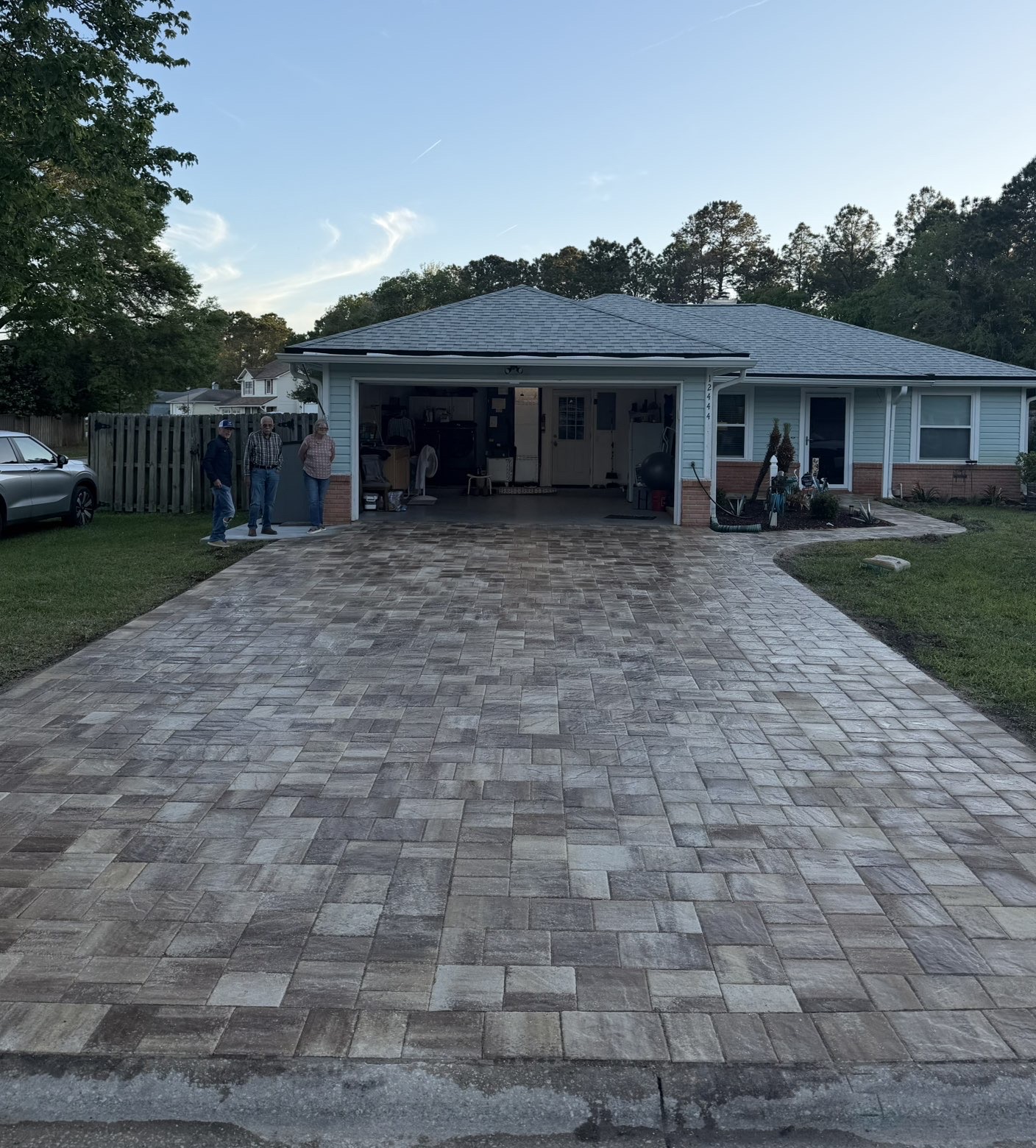 Paver driveway installation in a residential neighborhood